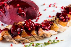 Roasted duck breast with cranberry sauce and vegetables